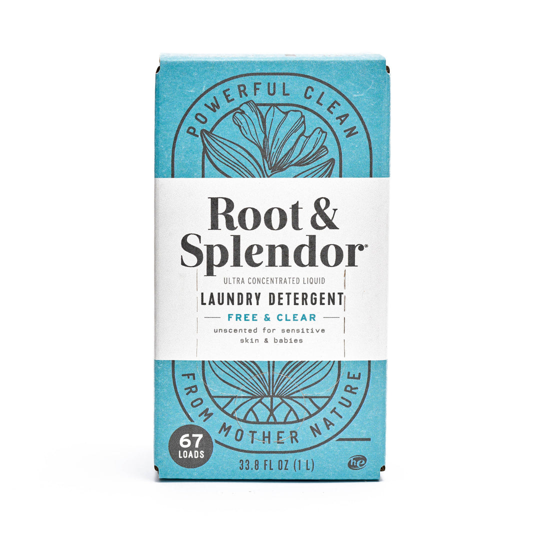 A blue and white box of Root and Splendor Laundry Detergent: Free and Clear, 1L (67 loads), features eco-friendly formula, botanical line art, and text highlighting powerful natural cleaning.