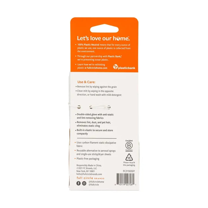 The product packaging for the Anti Static & Lint Removing Mitt by Full Circle Home displays Lets love our home, with usage instructions, care tips, and recycling info. An orange banner at the top highlights plastic neutrality and sustainability, perfect for eco-conscious users.