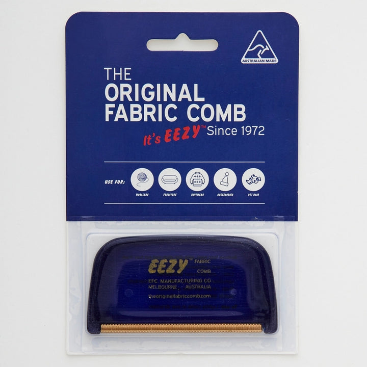 The EZY™ Fabric Comb-The Original Fabric Comb by The Original Fabric Comb is Australian-made, with a blue and white label. Its designed to remove pilling from wool, cotton, synthetics, and accessories. The de-piller is visible through transparent packaging.