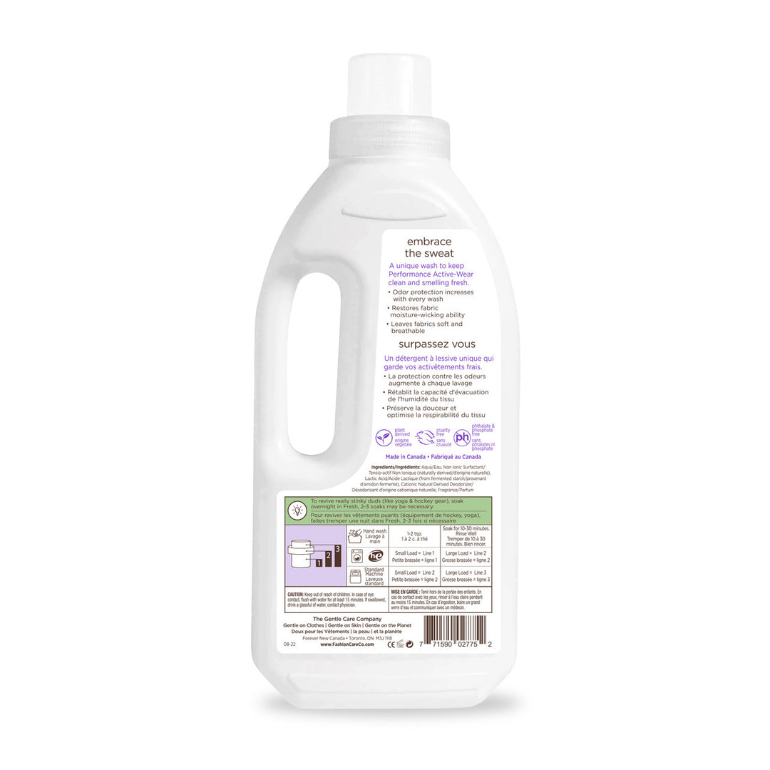 Back view of a Fresh® Activewear Wash by Fashion Care, a white 1L eco-friendly detergent bottle. Label showcases product info, instructions, and certifications in English and French. The cap doubles as a measuring cup, with stylish purple and green accents adding flair.