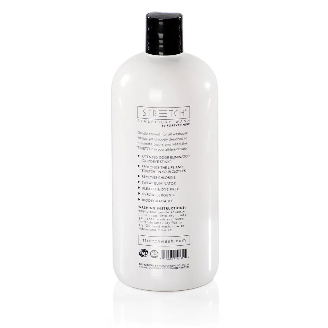 A white bottle of STRETCH Liquid Active Wear Detergent 32 oz by Forever New International, Inc stands against a pristine background, highlighting features like biodegradable odor elimination, fabric protection, and a bleach-free formula. Instructions and the website URL are clear on the back.