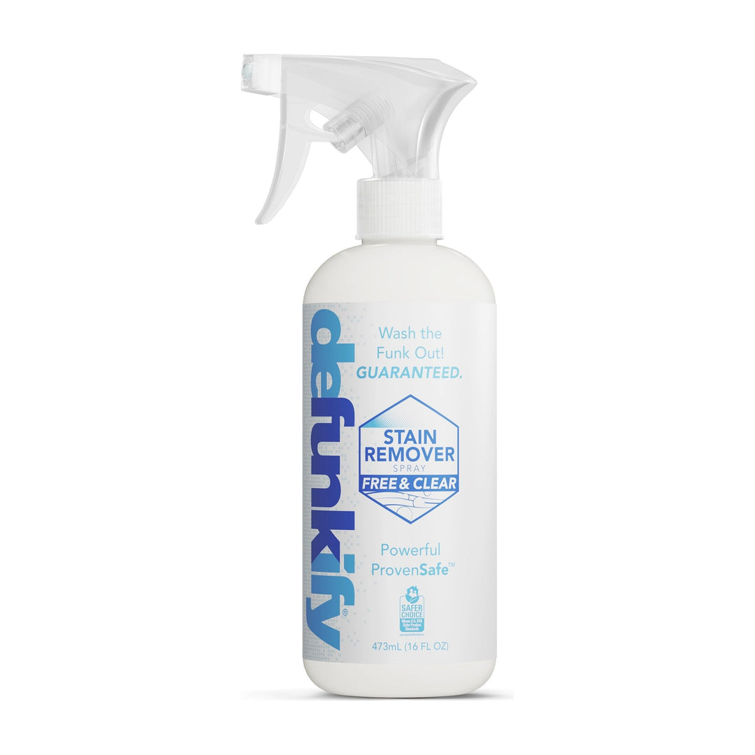 The Defunkify Stain Remover Spray-Free and Clear, 16 oz bottle, has a clean white design with blue text promoting the Powerful Enzyme ProvenSafe formula and the tagline Wash the Funk Out!.