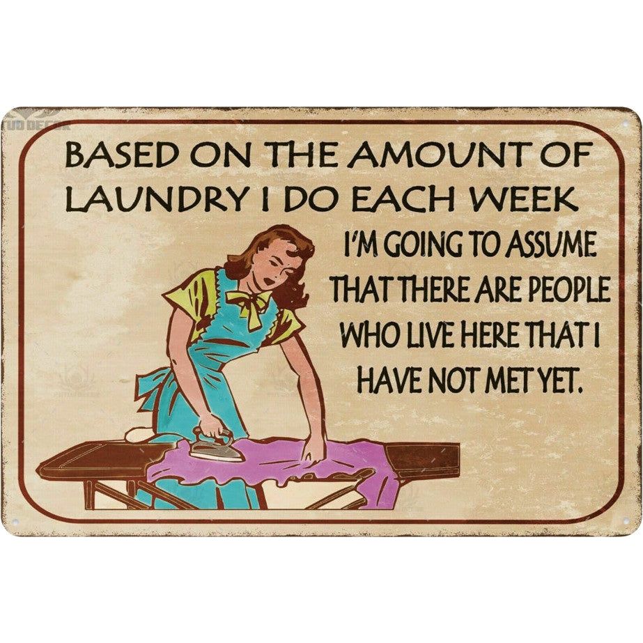 The Laundry Room Amount of Laundry’ Sign by All Things Laundry features a vintage tin design with a humorous quote about doing laundry for unseen roommates, making it perfect for quirky home decor.