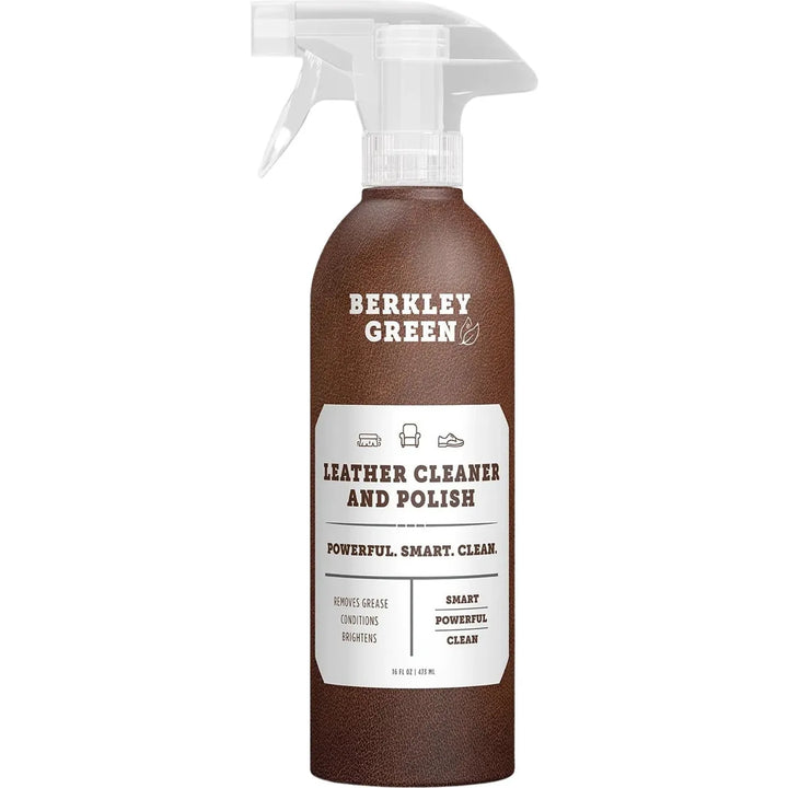 A brown spray bottle labeled Leather Cleaner - Free and Clear- 16 oz by Berkley Green features icons of a shoe, handbag, and car seat. It provides powerful cleaning for leather accessories as an eco-friendly option with the text: Powerful. Smart. Clean.