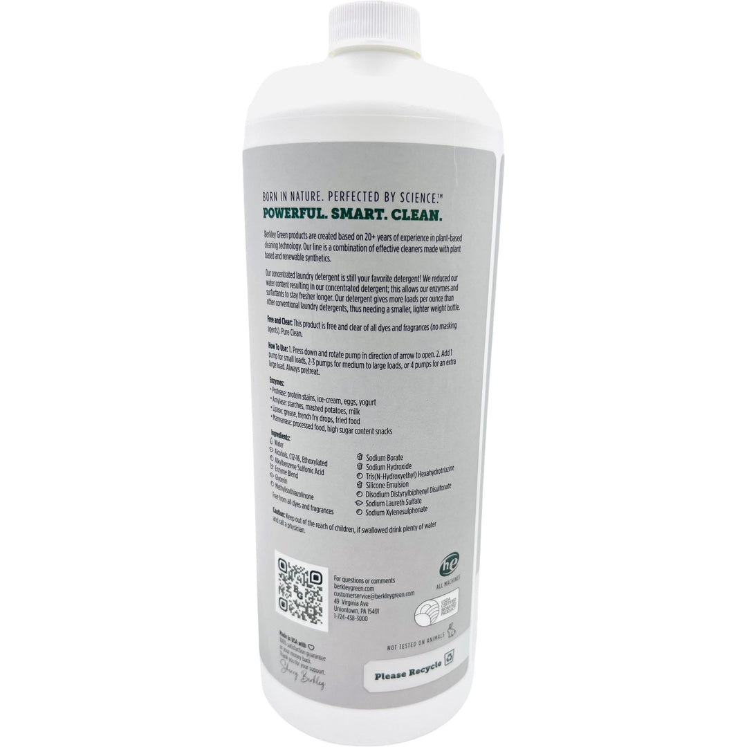 The back of a white, cylindrical bottle of Berkley Greens Baby 10x Laundry Detergent-Free and Clear-30 oz displays its plant-based formula. The gray label includes features, ingredients, and instructions, with QR codes and recycling symbols neatly placed at the bottom.