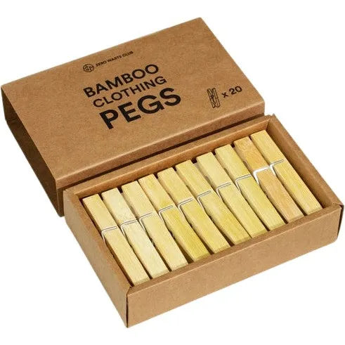 A cardboard box displays 20 neatly arranged bamboo pegs from Zero Waste Club, labeled BAMBOO Clothespins/Pegs - Pack of 20, featuring a peg illustration emphasizing its plastic-free pledge and use of sustainably sourced bamboo.