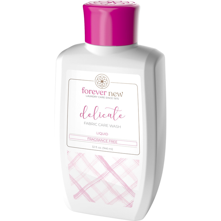 A 32 oz white bottle with a pink cap, labeled Delicate Liquid Detergent-Fragrance Free by Forever New International, Inc, is a gentle cleanser for sensitive skin. It features a minimalist design with light pink accents and is ideal for delicate fabric care.