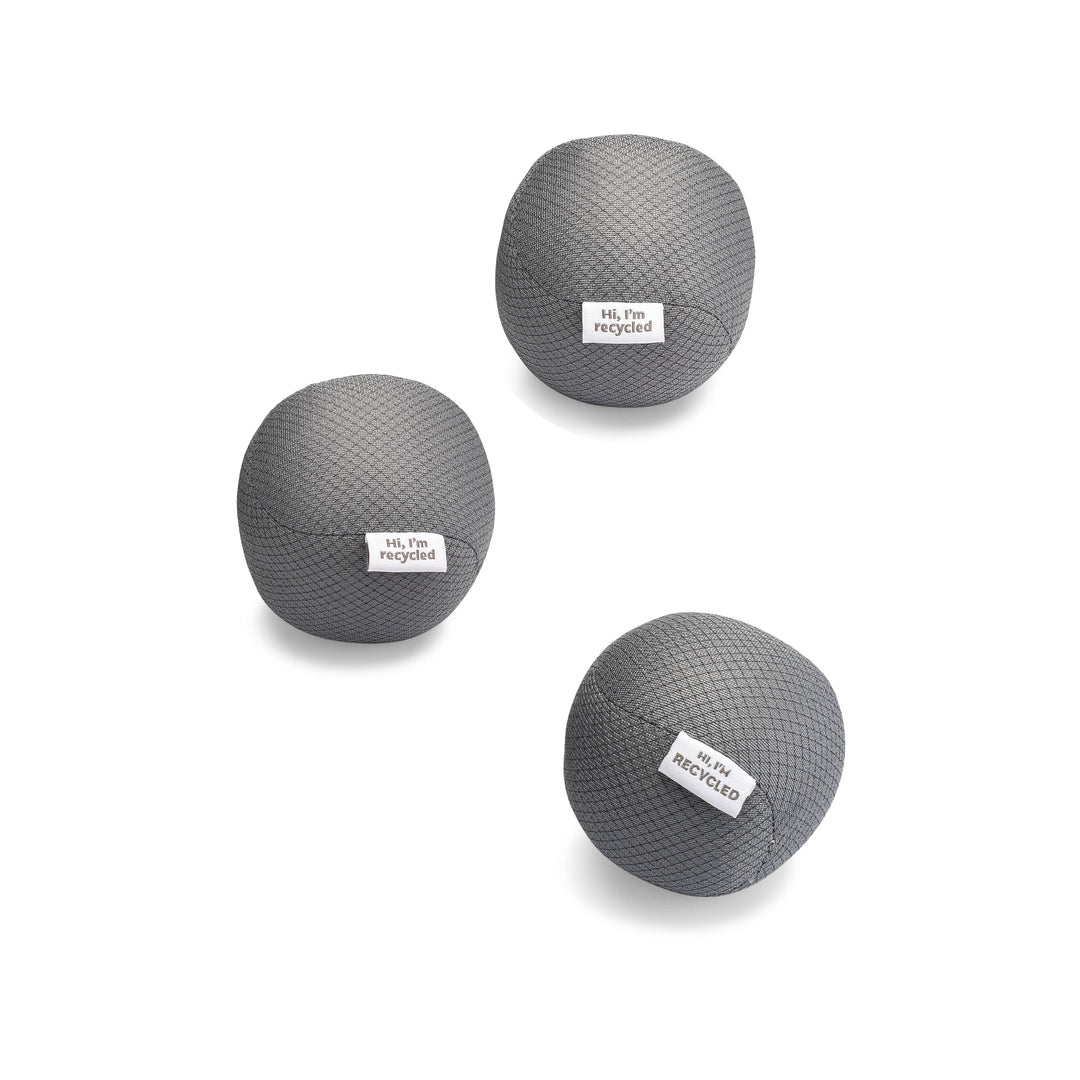 Three 8.5cm gray, textured Anti-Static Dryer Balls by Full Circle Home form a triangle on a white background. Each eco-friendly ball features the label Hi, Im recycled, offering a sustainable, vegan alternative to enhance your drying routine.