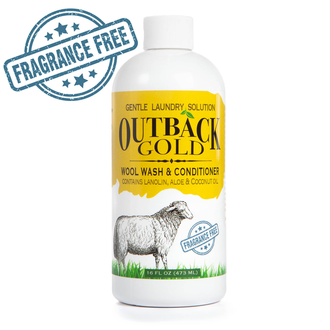 The 16 oz Wool Wash and Conditioner by Outback Gold from Desert Breeze Distributing features a yellow and white label with a sheep illustration. This eco-friendly, fragrance-free detergent is gentle on sensitive skin, enriched with lanolin, aloe, and coconut oil.