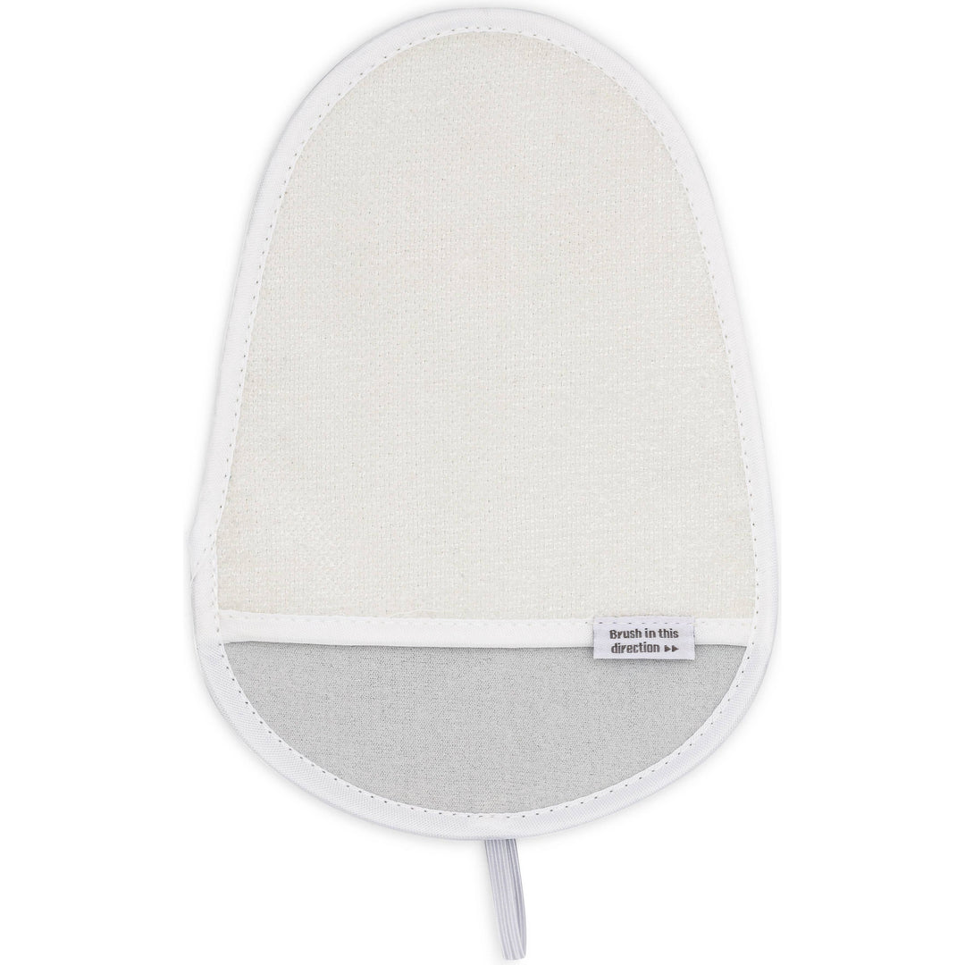 The Anti Static & Lint Removing Mitt by Full Circle Home is a beige exfoliating shower mitt with a white border and labeled brush in this direction. It exfoliates and removes lint efficiently and includes a loop for easy hanging.