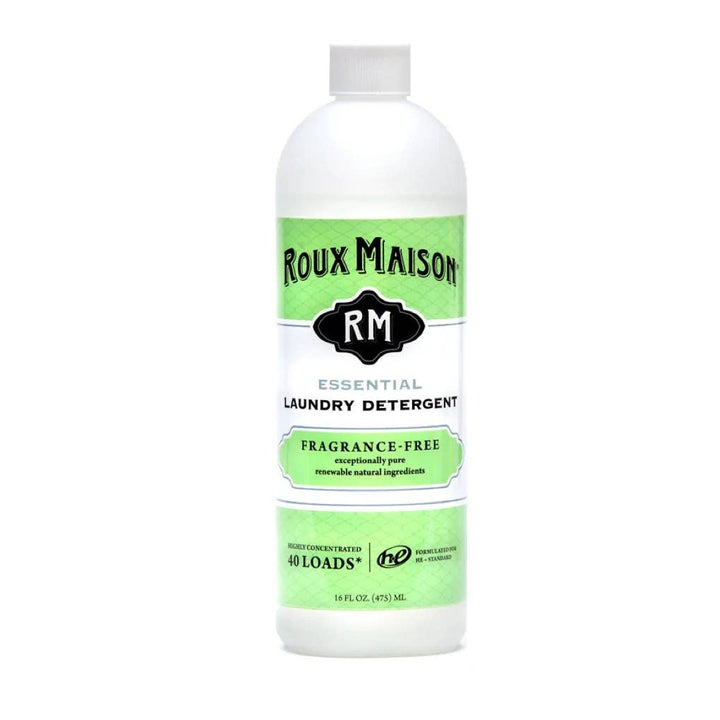 A 16 oz bottle of Roux Maison Essential Laundry Detergent features a green and white label, highlighting its biodegradable and 1,4 Dioxane-free formula. Made with natural ingredients, this fragrance-free detergent is highly concentrated and suitable for 40 loads.